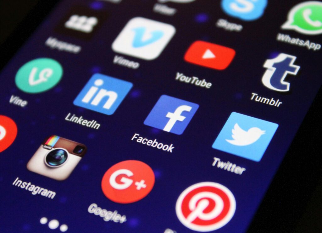 pexels-photo-267350-267350 - Crane Nectar Close-up of a smartphone screen showing various social media app icons such as Facebook and Twitter.